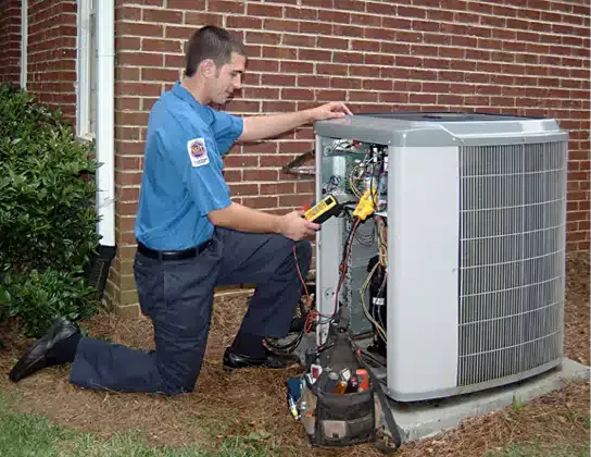 Technician working on AC unit in Colorado Springs, CO.