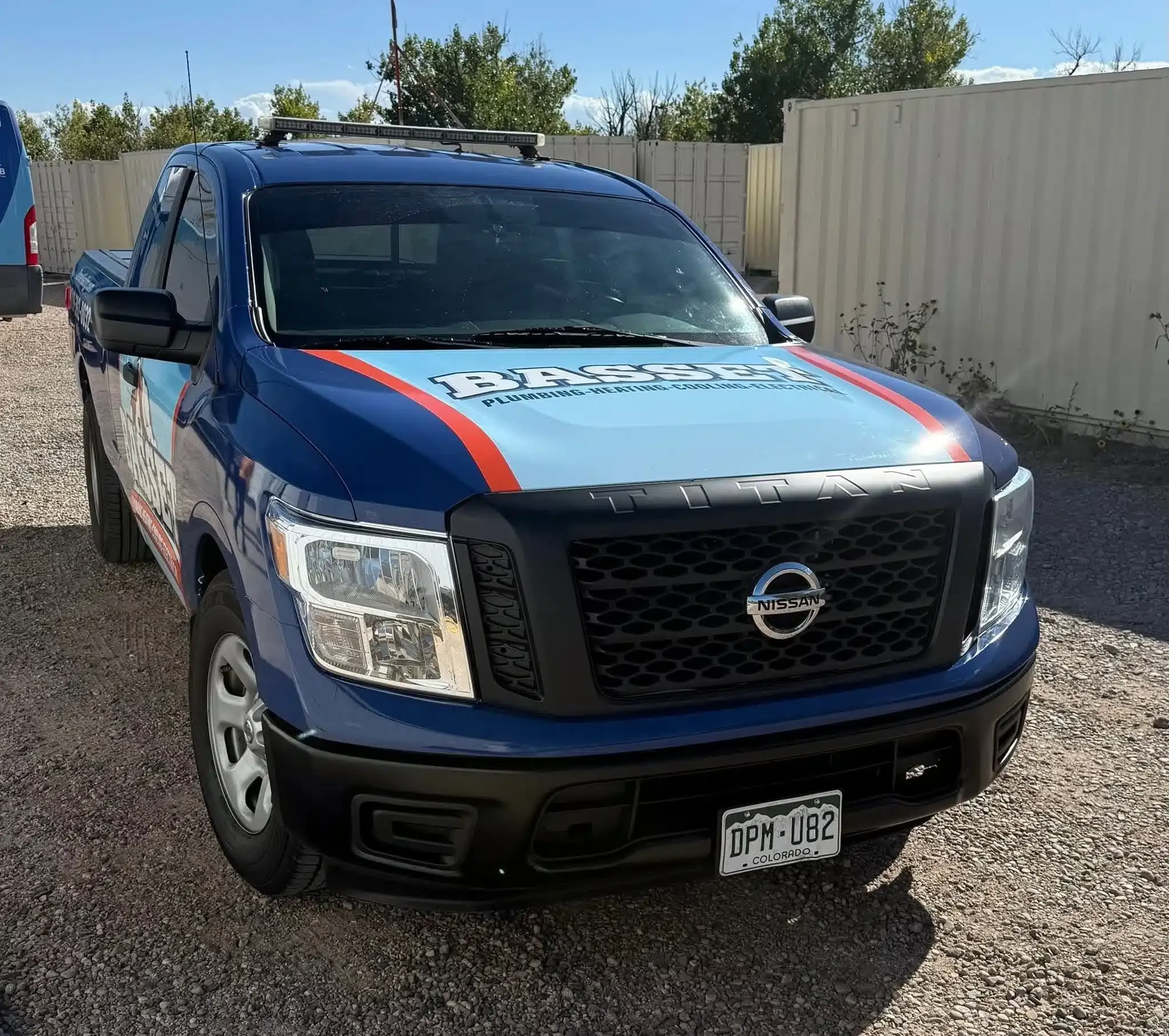 BASSETT plumbing and heating service truck parked in Colorado Springs
